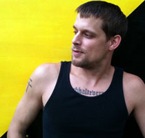 File:Ademo in front of anarcho-capitalist flag.jpg